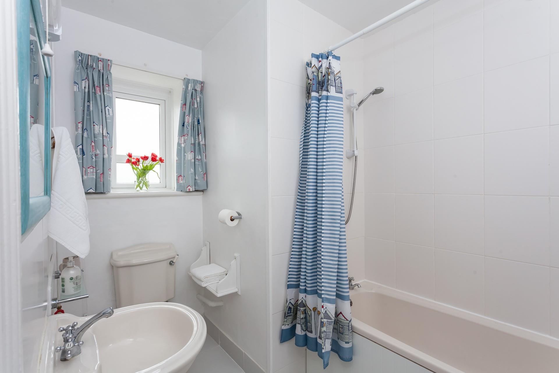 Wash off the sand from a day on the beach in the shower.