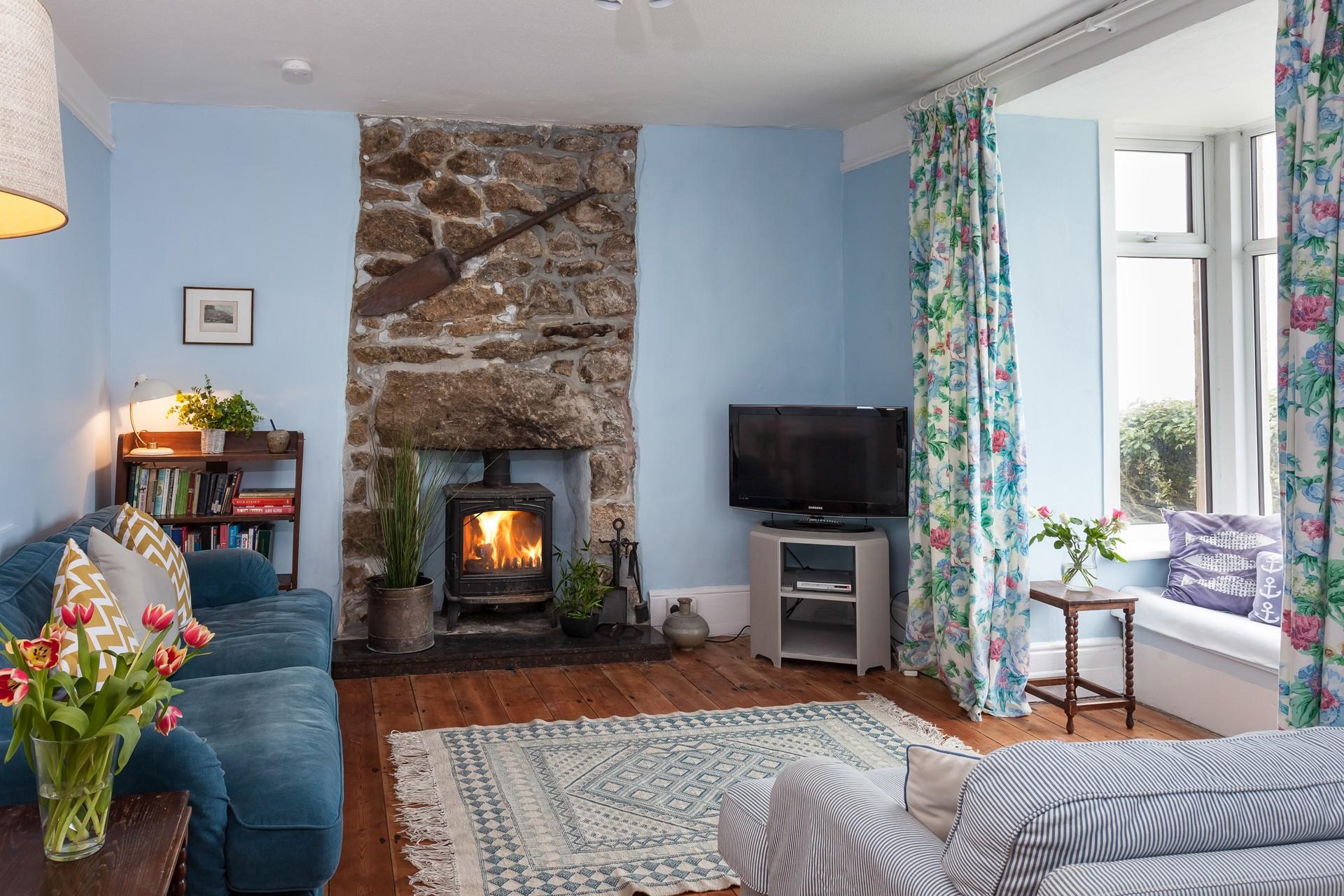 The sitting room has a woodburner which will keep you toasty in the colder season. 
