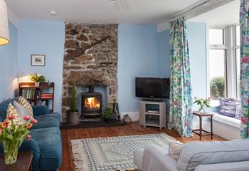 The sitting room has a woodburner which will keep you toasty in the colder season. 