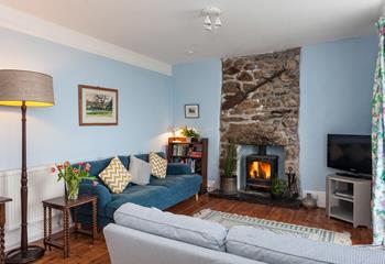 After a wintry walk on Porthcurno beach, light the woodburner and cosy up in the living room.