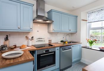 The well-equipped kitchen is perfect for the chef of the family to cook delicious meals.