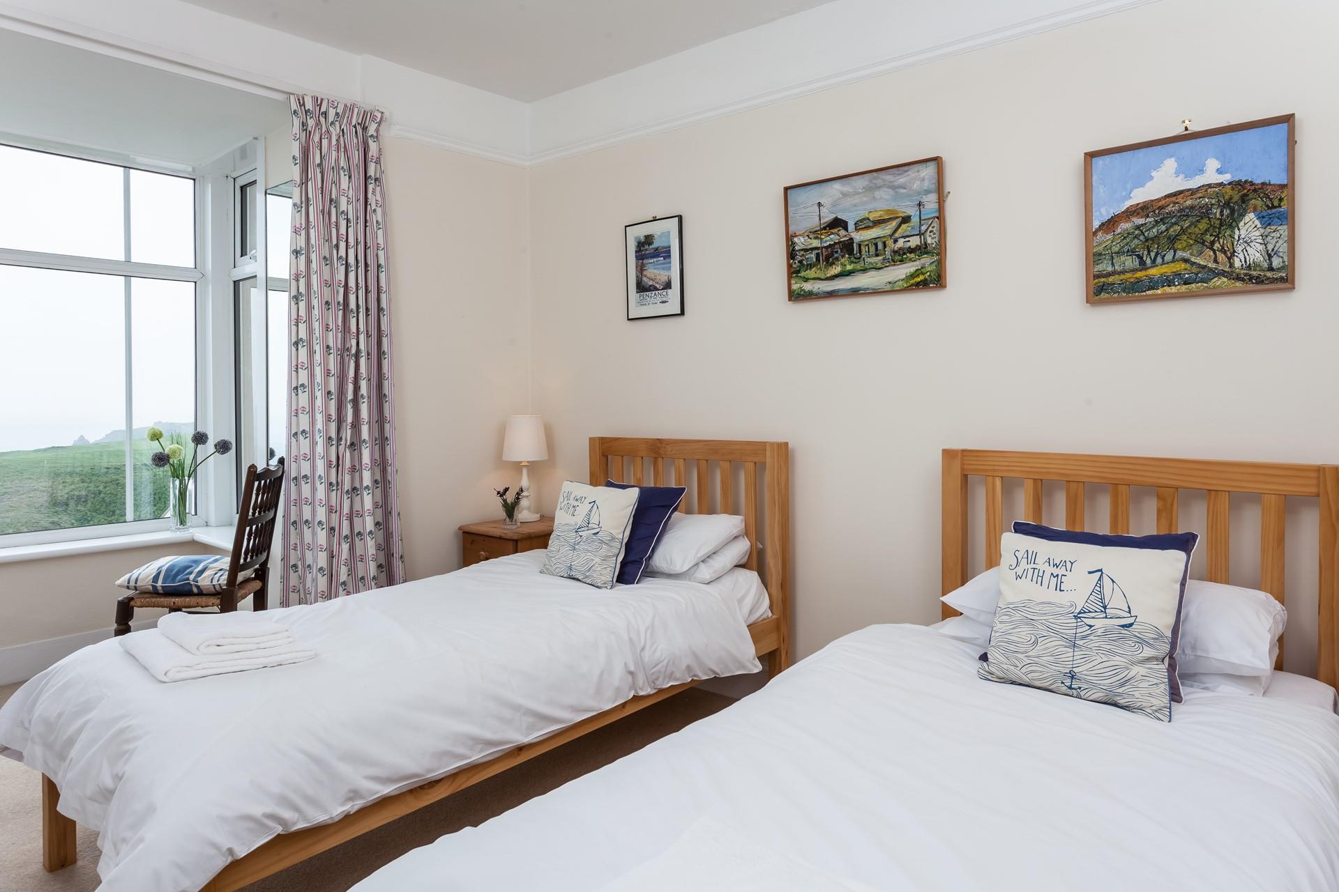 The 2nd bedroom is a twin room with sea views.