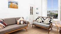 Curl up with a good book and enjoy a lazy afternoon on the sofa overlooking the town. 