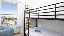 Full-sized bunks create a cosy and inviting space to rest your head. 