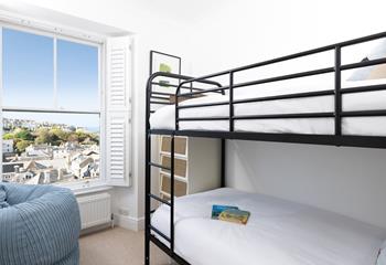 Full-sized bunks create a cosy and inviting space to rest your head. 