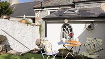 Enjoy your breakfast in the sun before exploring the nearby coastal path.