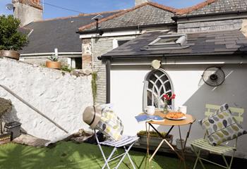 Enjoy your breakfast in the sun before exploring the nearby coastal path.