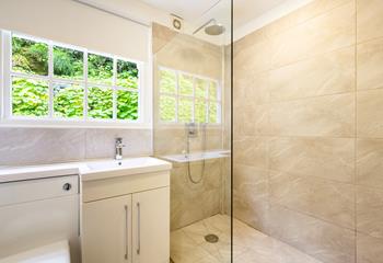 The downstairs wet room has a large enclosed shower to wash off after a day at the beach. 
