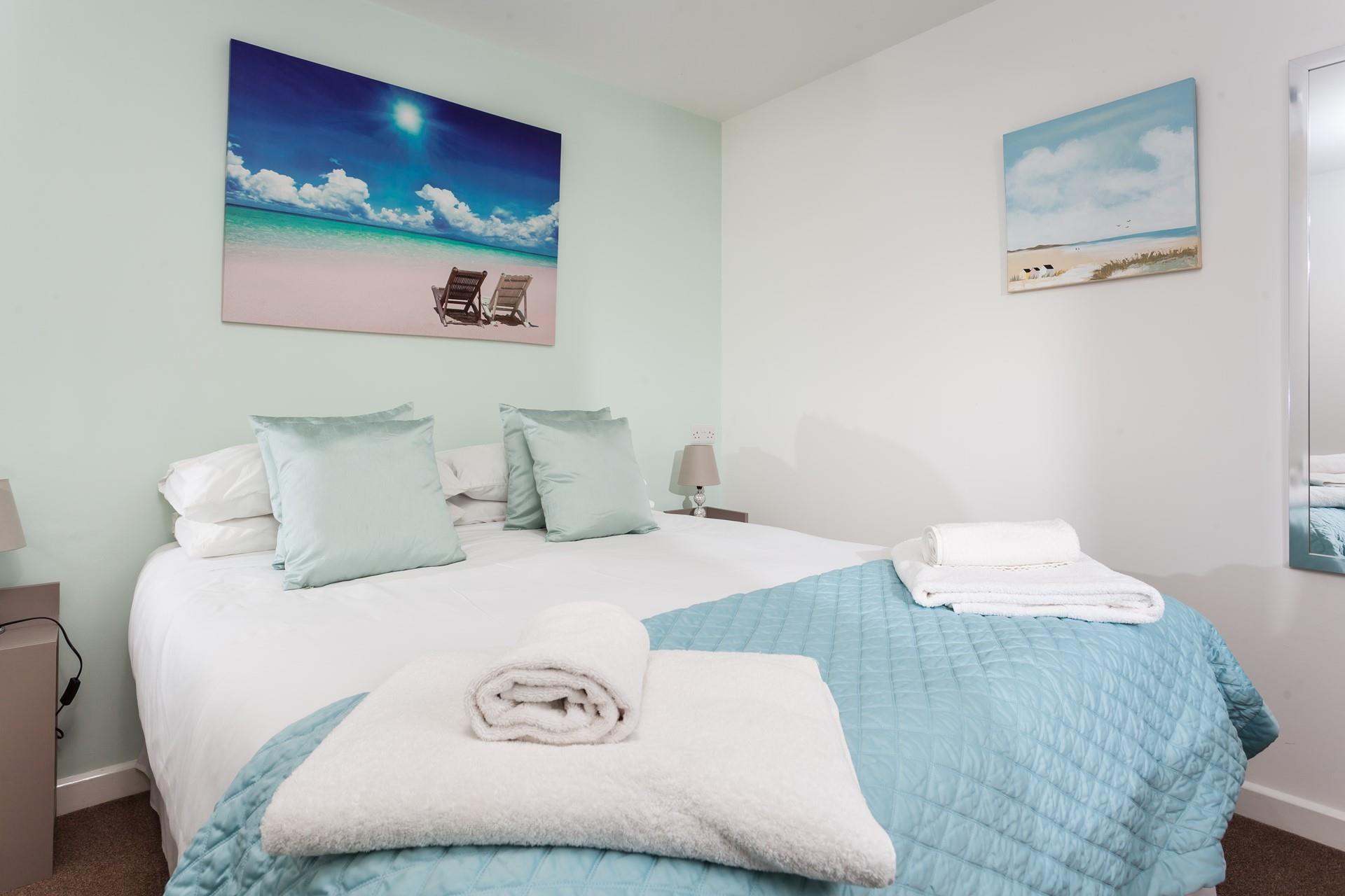 Bedroom 1 has a sumptuous king size bed offering a restful night's sleep after a day of exploring.