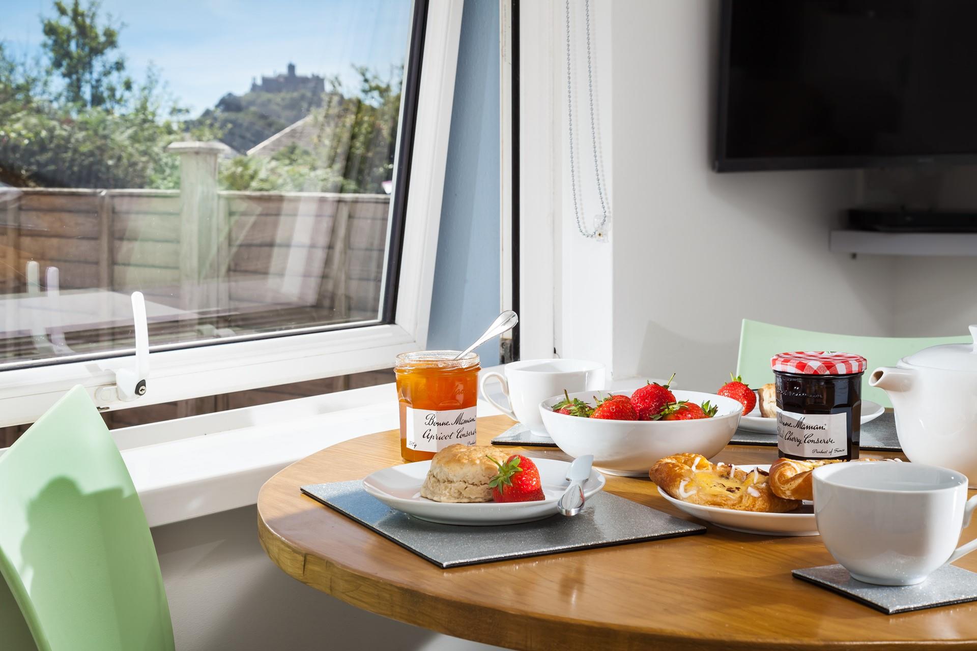 Enjoy a cream tea on a sunny afternoon looking over to the Mount.