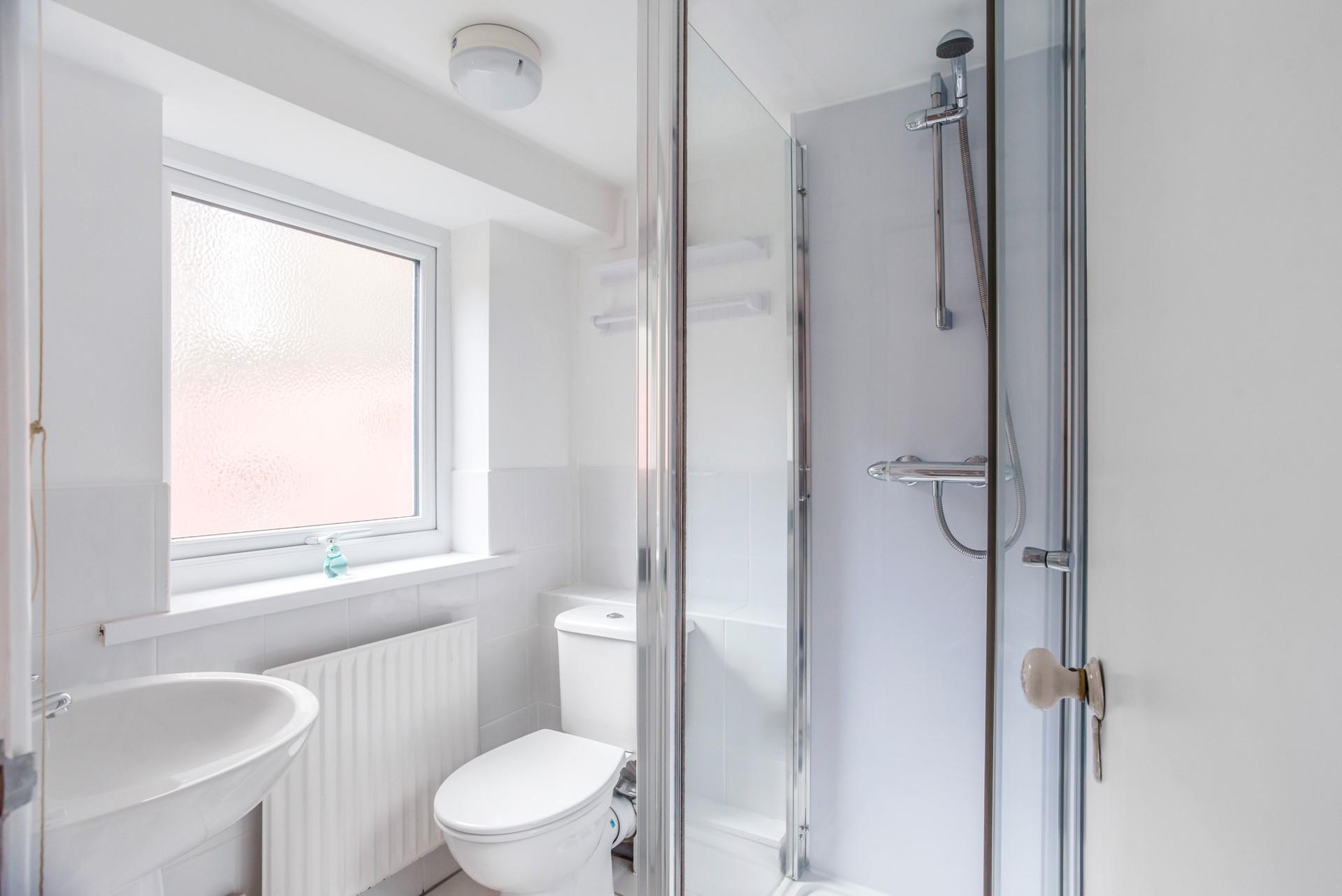 Wash off sandy toes in the shower after a day spent on Gylly Beach.