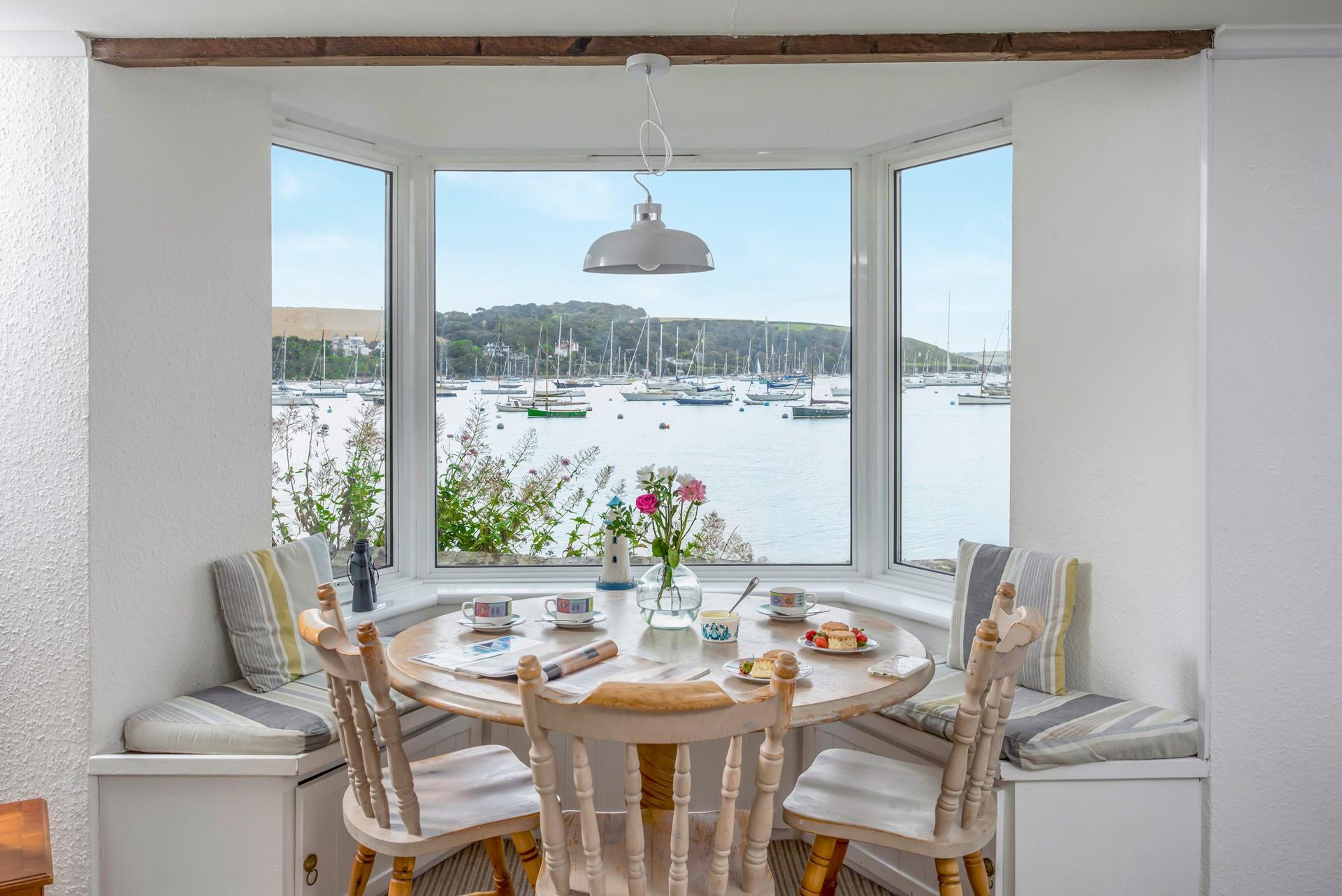 Indulge in a mouth-watering cream tea whilst watching the comings and goings of the harbour.