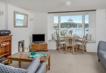 Wooden beams, seaside decor and cosy sofas ensure the room has a homely, welcoming feel.