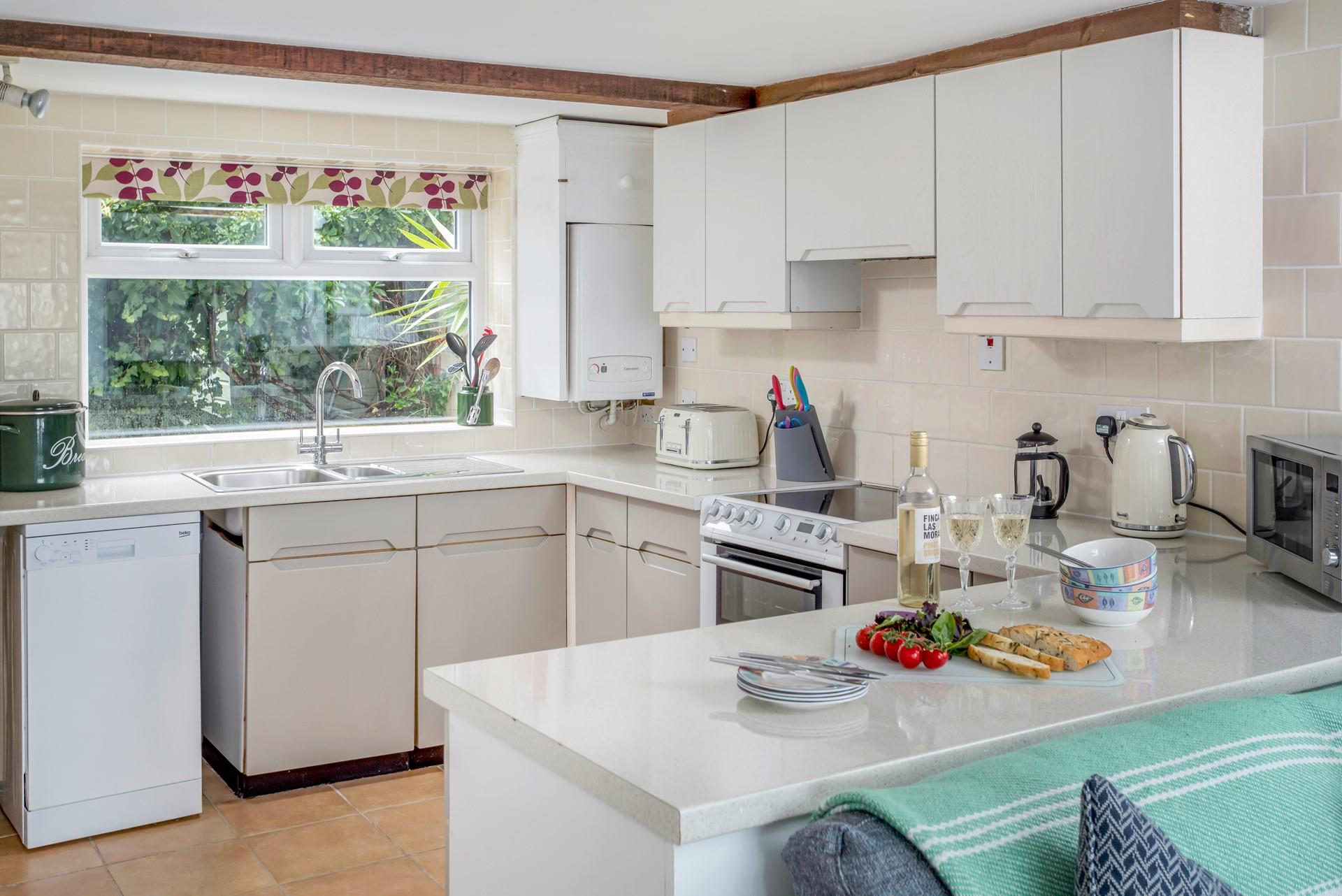 The kitchen is well-equipped and spacious, offering the perfect place to whip up delicious meals!