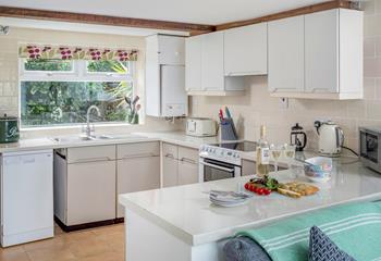 The kitchen is well-equipped and spacious, offering the perfect place to whip up delicious meals!