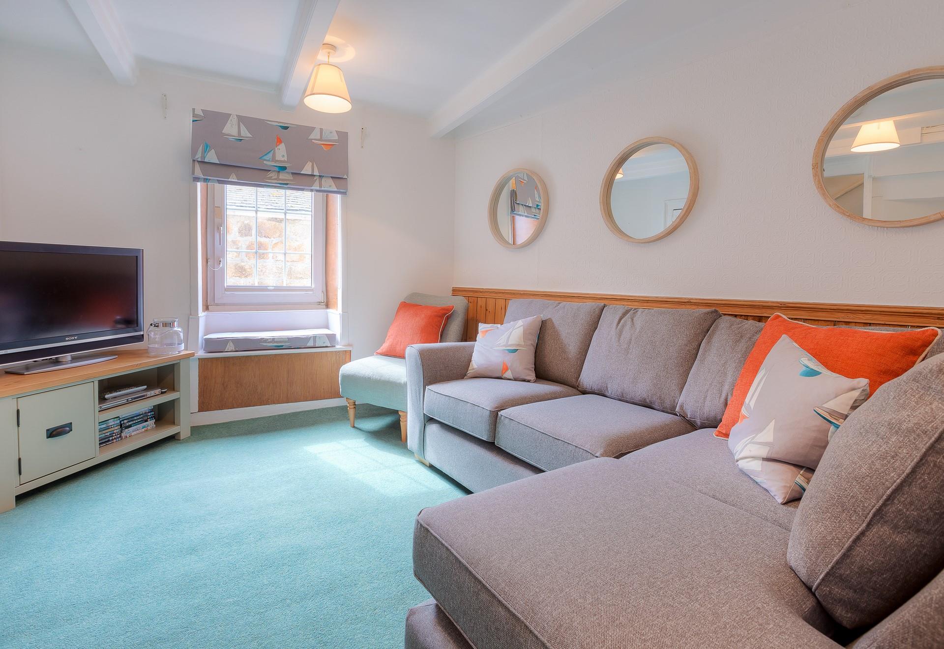 Sink into the sofa in the sitting room and relax with a good film on the TV.