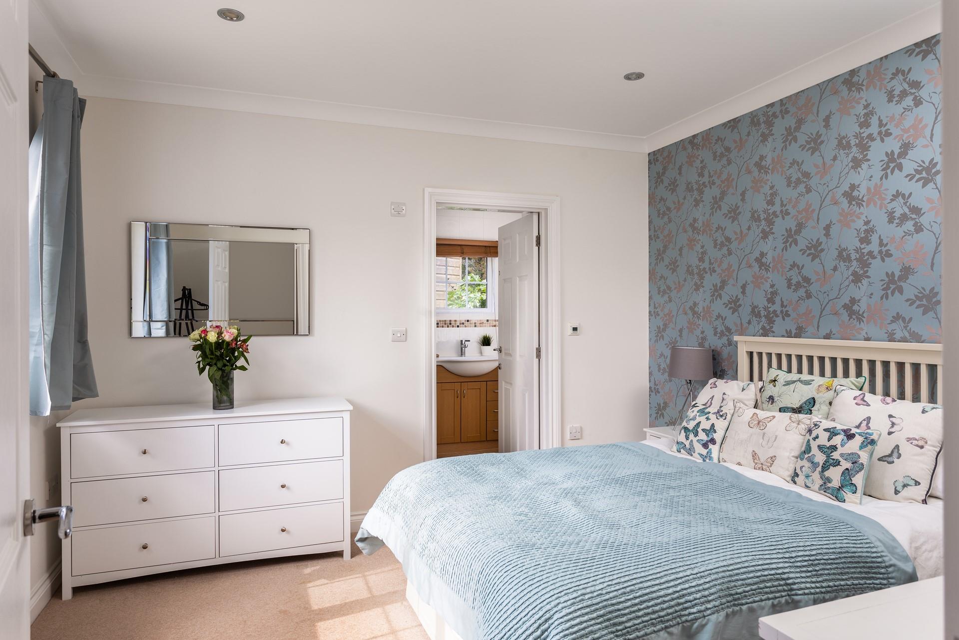 Elegant and stylish, this beautifully designed bedroom offers a calming retreat to unwind at the end of the day. 