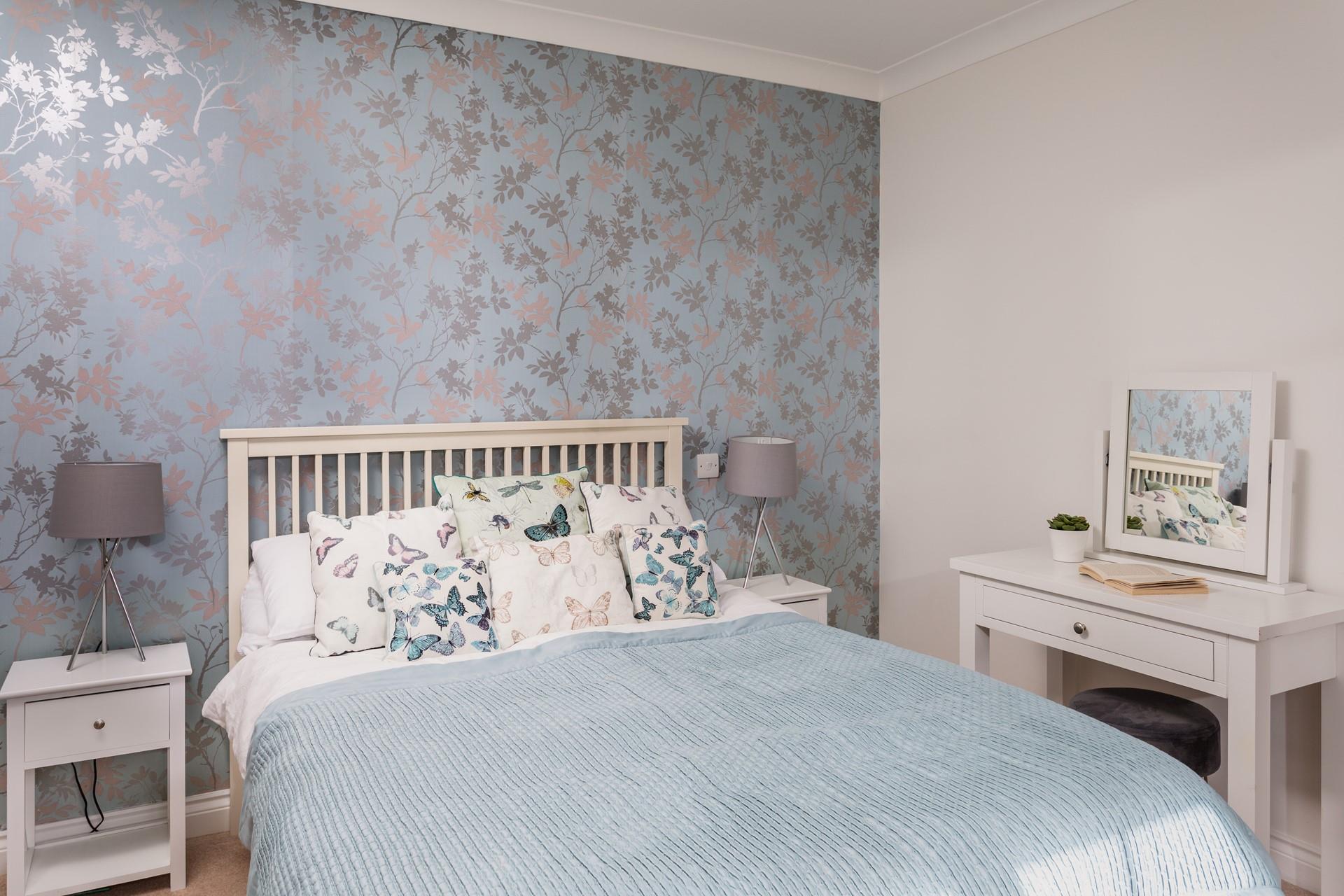 Light and airy, this beautiful bedroom also has a modern ensuite shower room. 