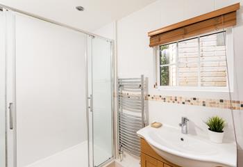 Bright and beautifully finished, the en suite shower room adds privacy and convenience for guests. 
