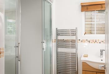 The en suite benefits from a heated towel rail so you can enjoy the added luxury of warm towels. 