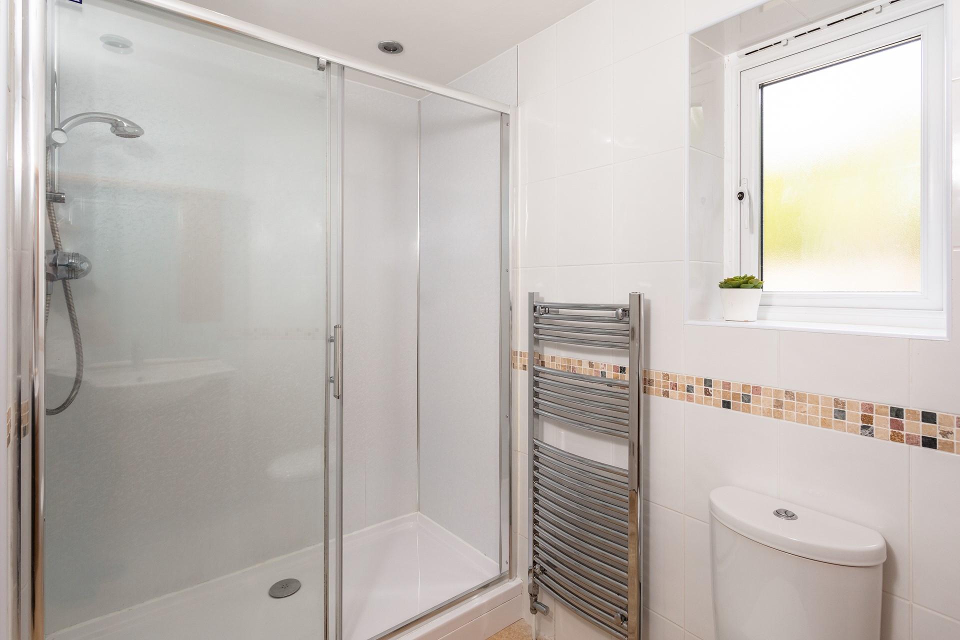 Take a long soak in the large shower, there's no need to rush on holiday. 