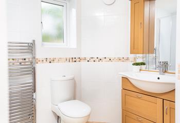 The en suite shower room is spacious and has plenty of room to store your toiletries. 