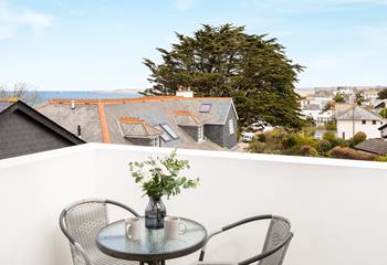 The private balcony overlooks the pretty urban area and has a sea view across Carbis bay.