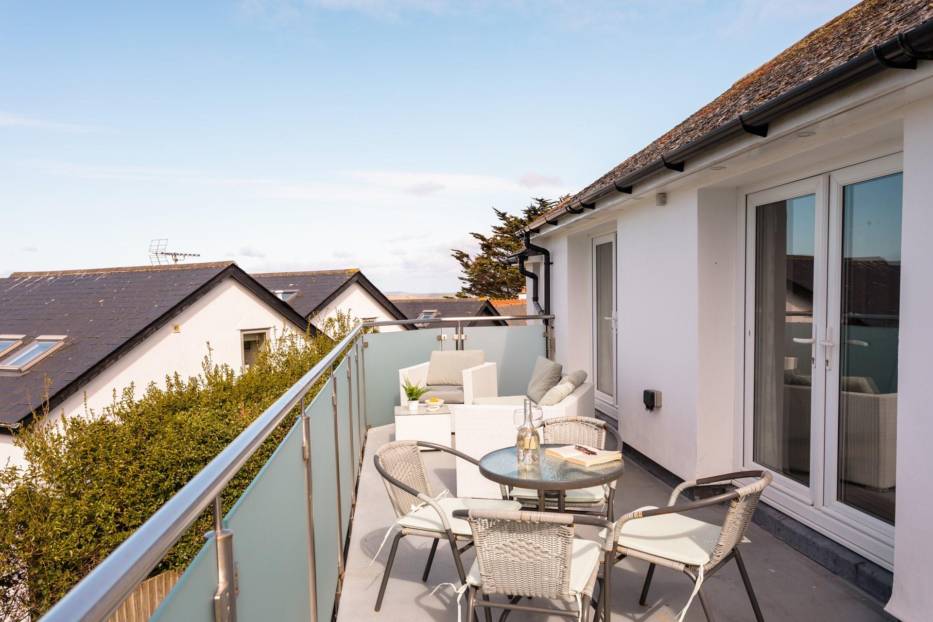 While away the hours on the balcony, soaking up the views and the Cornish sea air. 