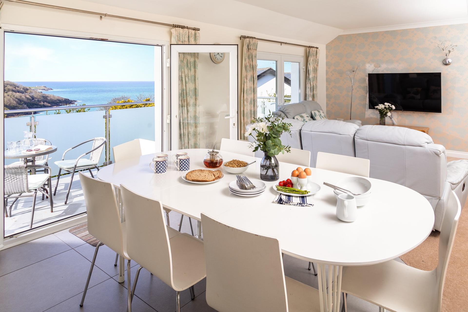 Elegantly finished, the light and airy top floor living area offers elevated views across the bay. 