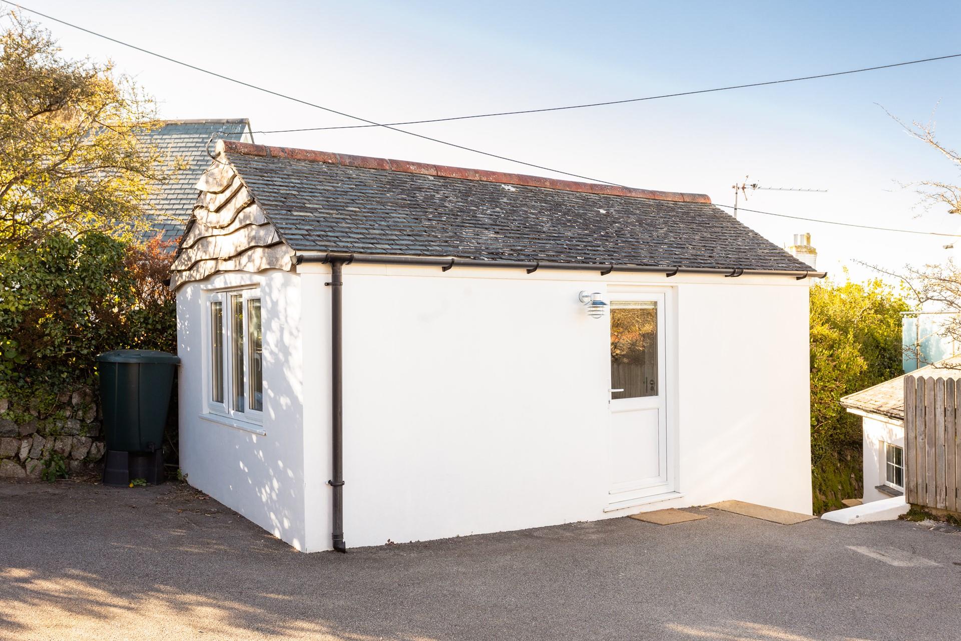 The annex, with an additional bedroom and bathroom, is detached from the main house. 