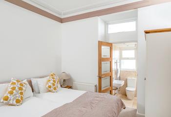 Bedroom 2 has zip and link beds and an en suite, which provides a relaxing space for kids or adults.