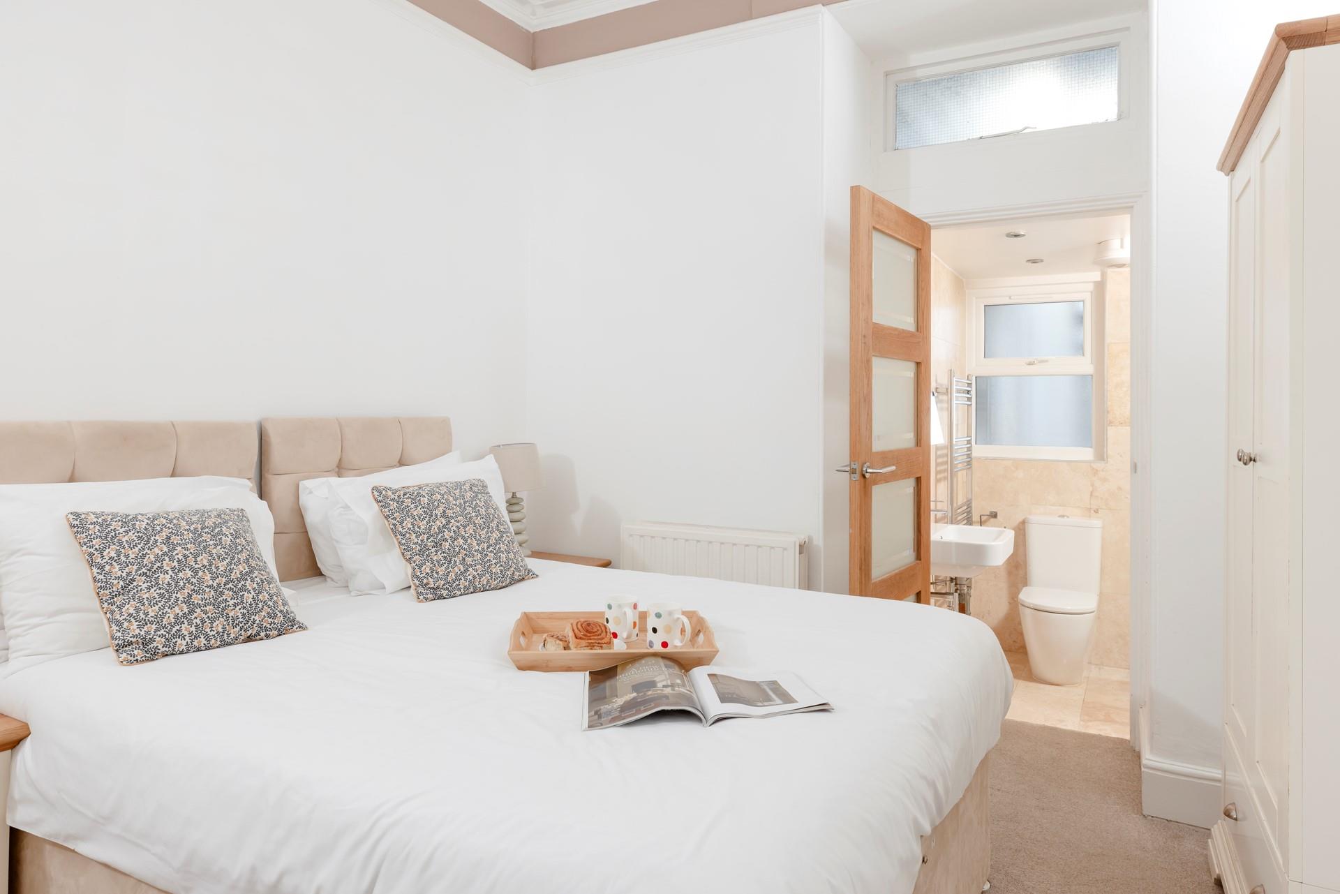 Bedroom 2 has zip and link beds and an en suite, which provides a relaxing space for kids or adults.