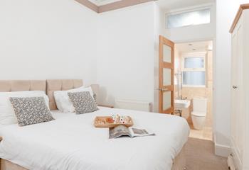 Bedroom 2 has zip and link beds and an en suite, which provides a relaxing space for kids or adults.