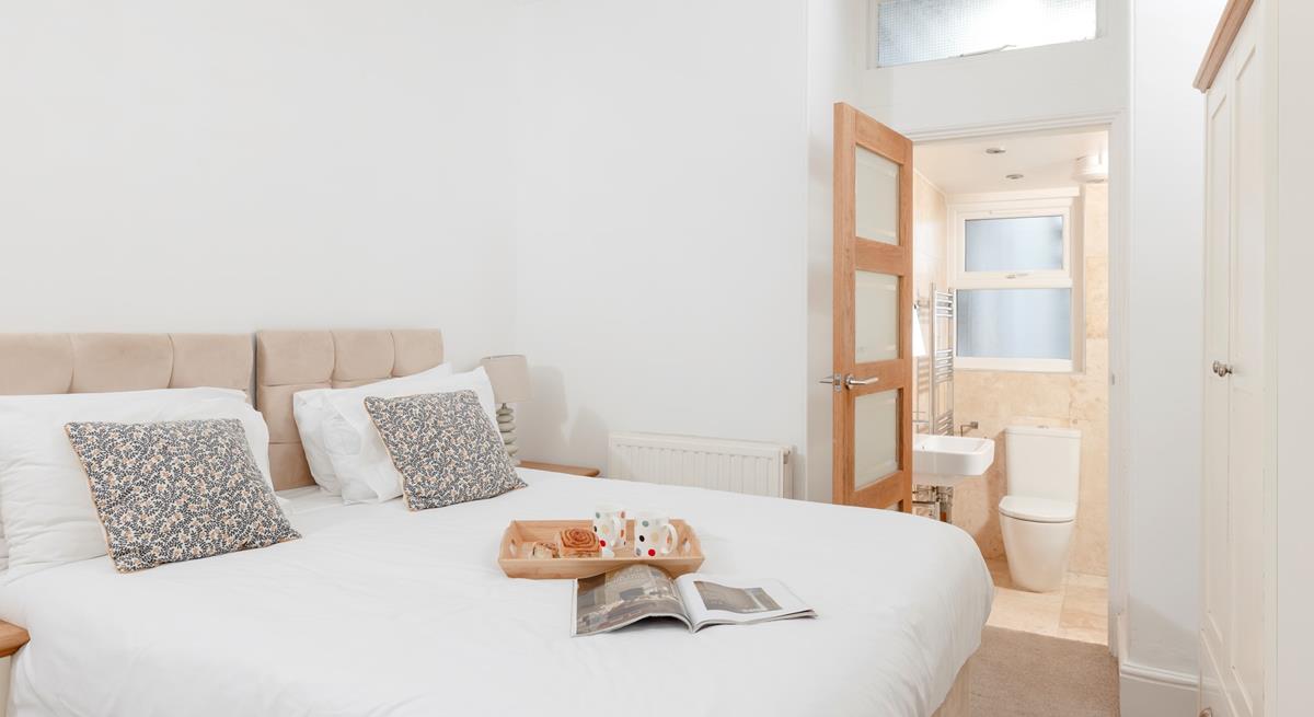 Bedroom 2 has zip and link beds and an en suite, which provides a relaxing space for kids or adults.