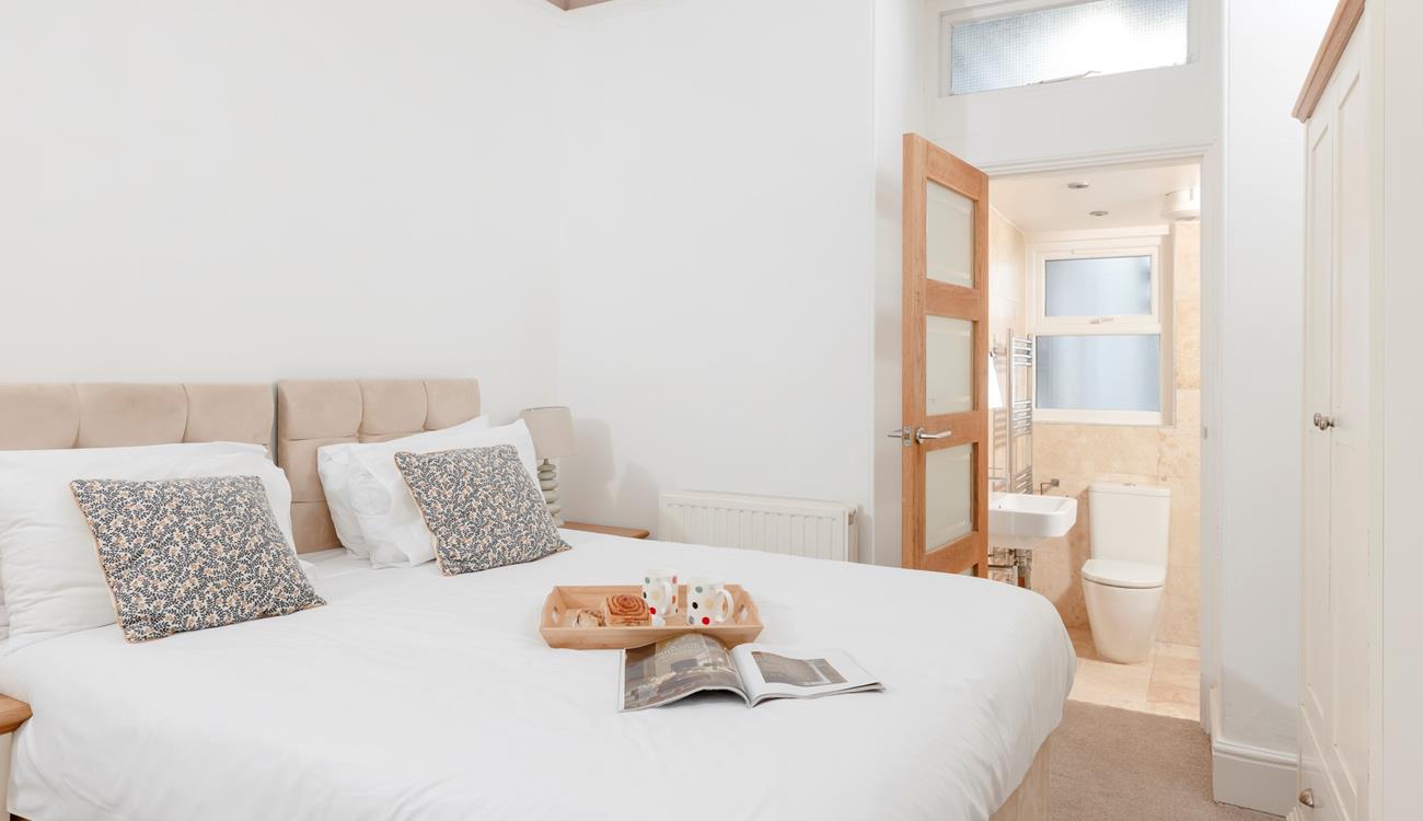 Bedroom 2 has zip and link beds and an en suite, which provides a relaxing space for kids or adults.