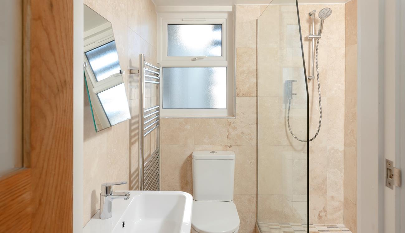 Wash off sandy toes in the shower after a day on the sand.