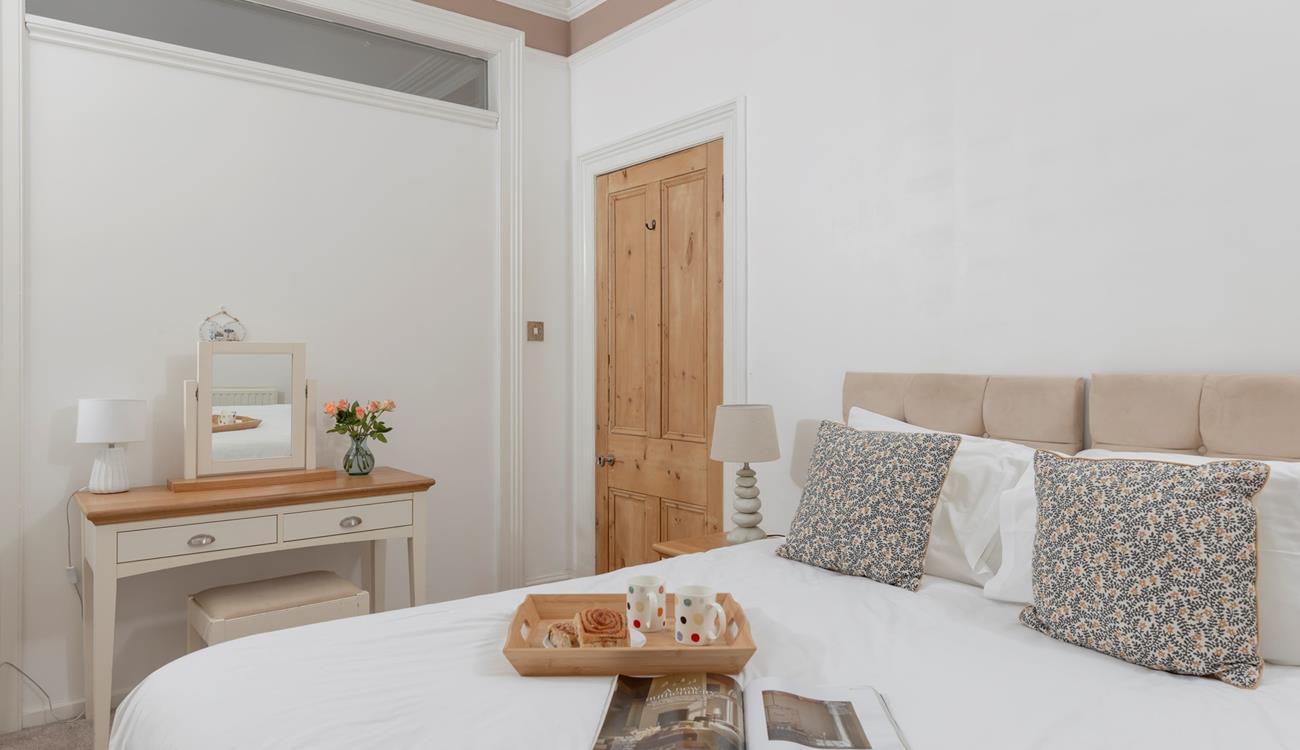 Get ready for the day at the dressing table.