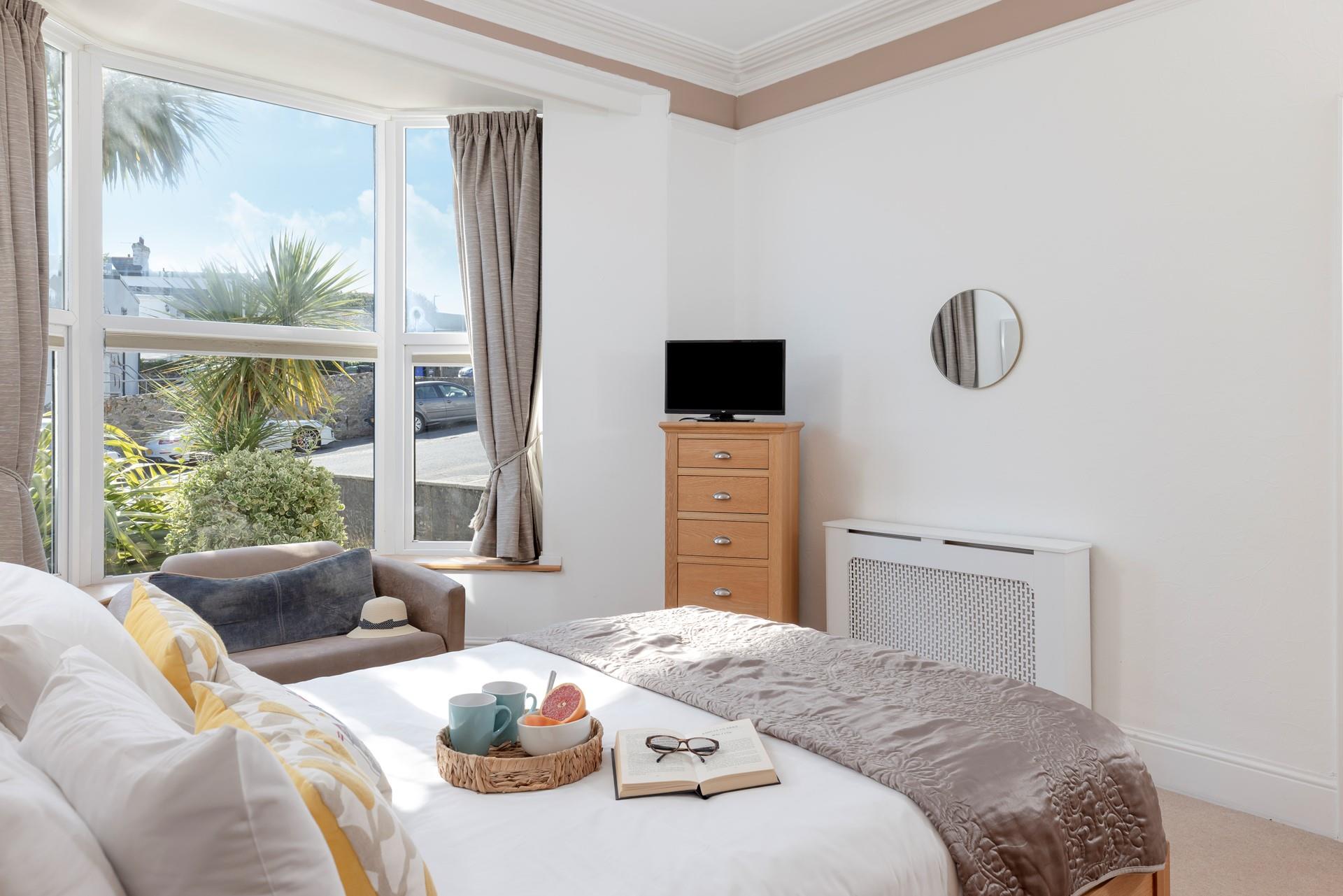 Bedroom 1 is on the ground floor and is filled with homely touches.