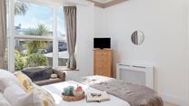 Bedroom 1 is on the ground floor and is filled with homely touches.