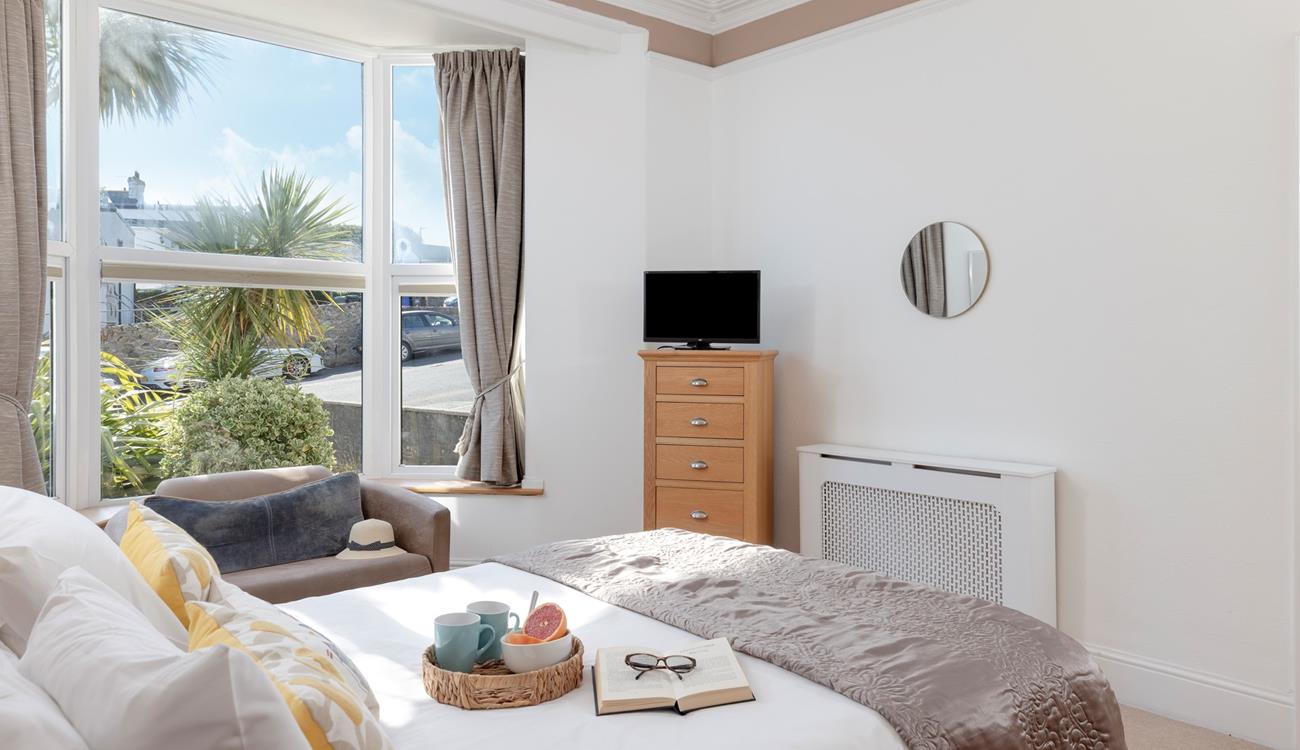 Bedroom 1 is on the ground floor and is filled with homely touches.