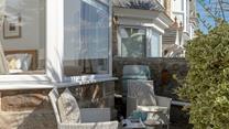 The front terrace has an additional seating area.