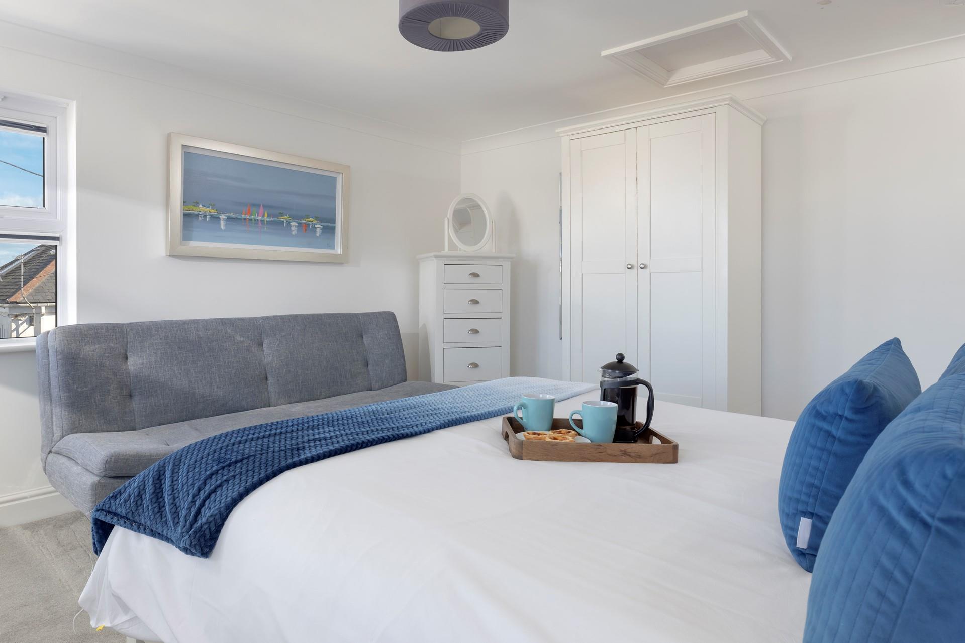 Bedroom 4 has a king size bed to spend cosy mornings sipping your morning cuppa.