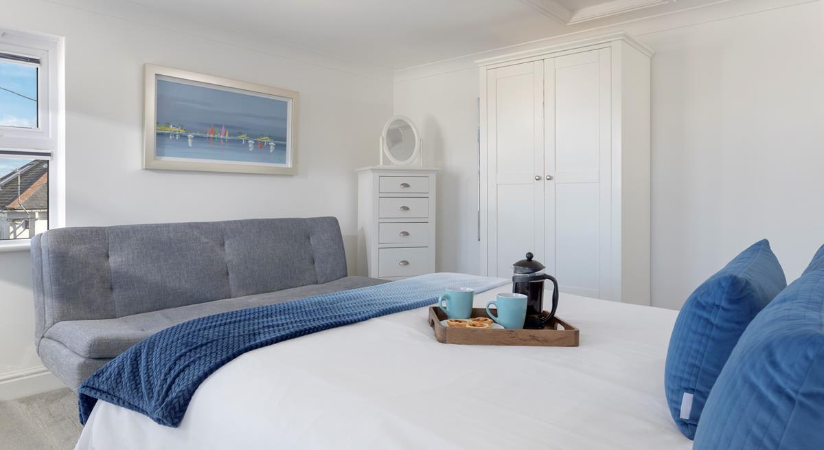 Bedroom 4 has a king size bed to spend cosy mornings sipping your morning cuppa.