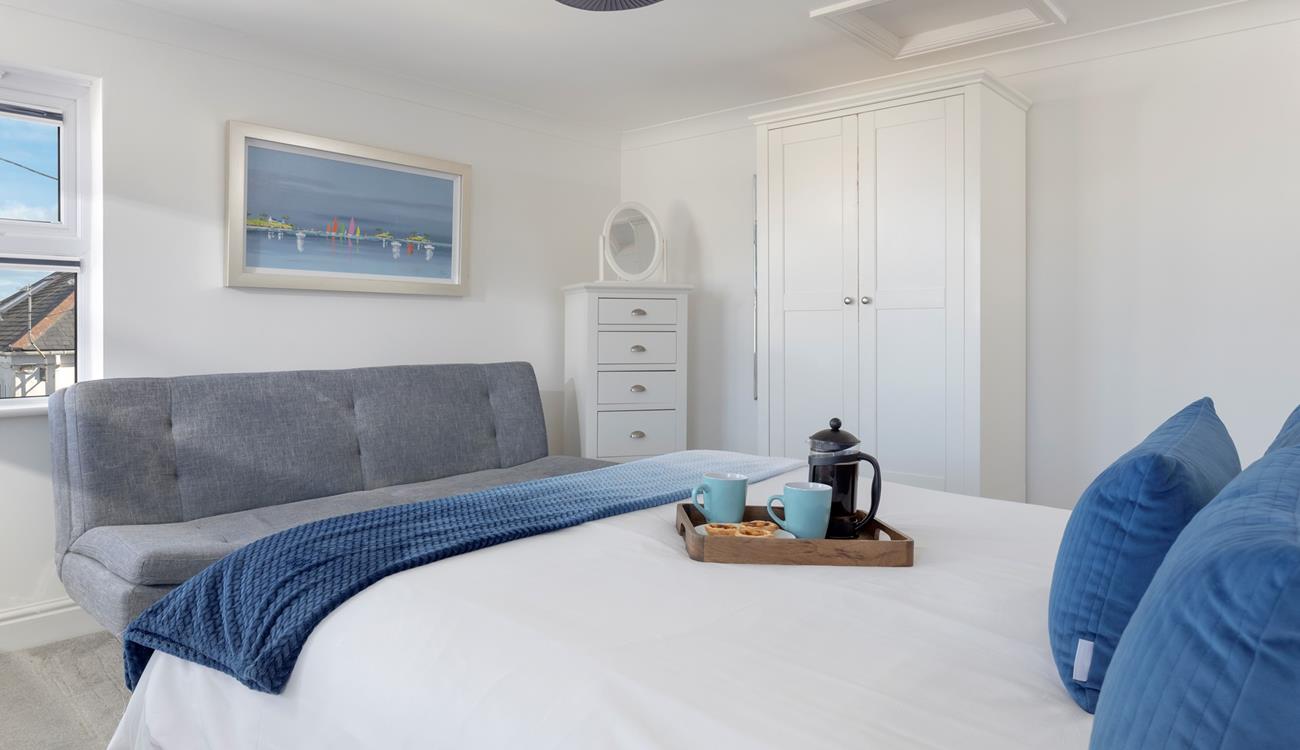 Bedroom 4 has a king size bed to spend cosy mornings sipping your morning cuppa.