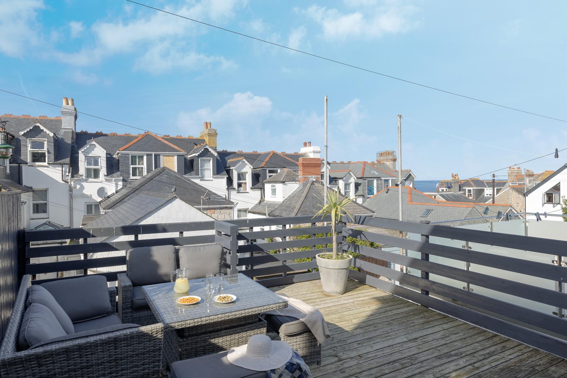 Enjoy a cold G and T on the outside decked terrace area.