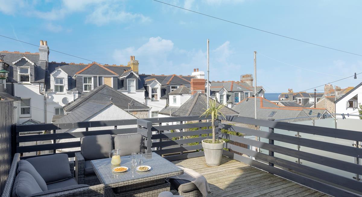 Enjoy a cold G and T on the outside decked terrace area.