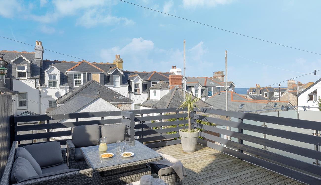 Enjoy a cold G and T on the outside decked terrace area.