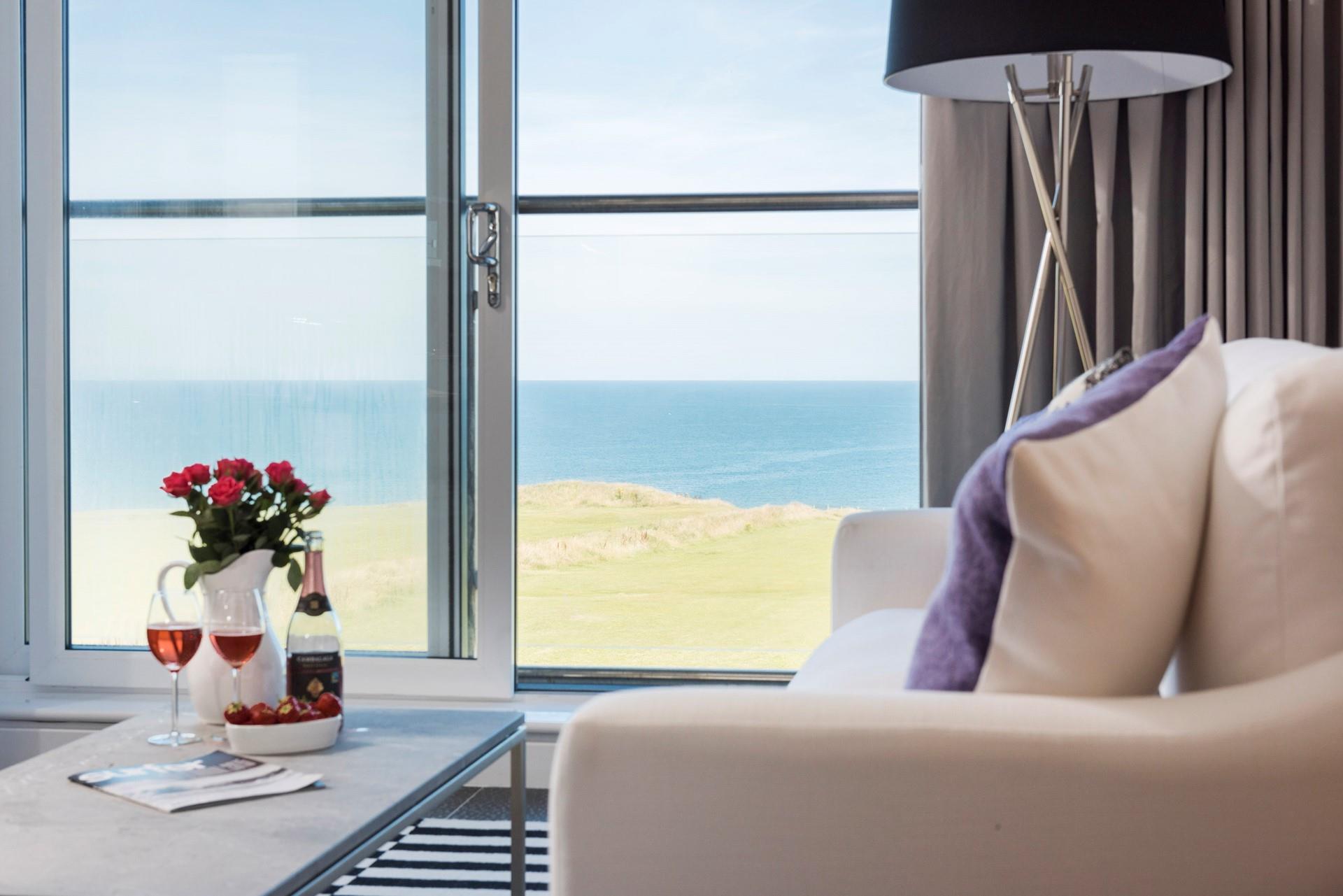 The sitting area has stunning views out to sea. Grab your drink of choice, curl up, and enjoy wave-watching.