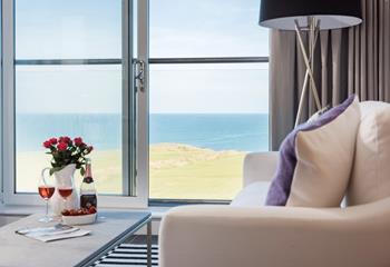 The sitting area has stunning views out to sea. Grab your drink of choice, curl up, and enjoy wave-watching.