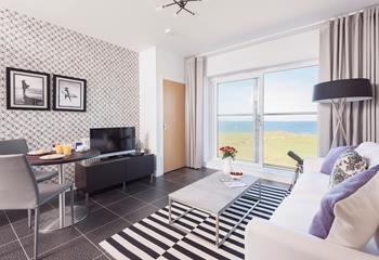 On the third floor, Atlantic Vista is a modern apartment with views from the Juliet balcony across the north coast. 